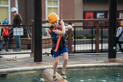 boy trying loggersports at adventure park in pigeon forge