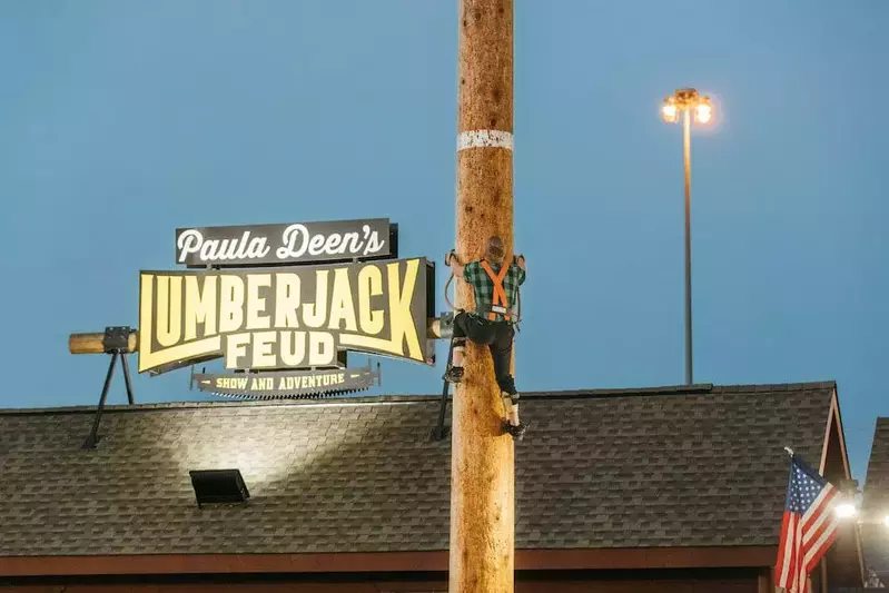 lumberjack climbing pole at lumberjack feud