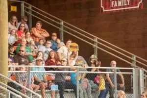 little girl in the crowd at Lumberjack Feud in Pigeon Forge